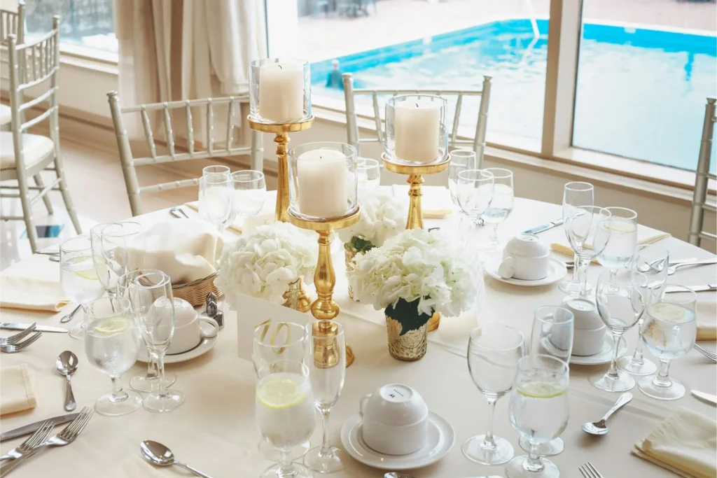 The White and Gold Elegant Setup
white and gold dessert table setup with gold candle holders white hydrangeas and elegant table setting