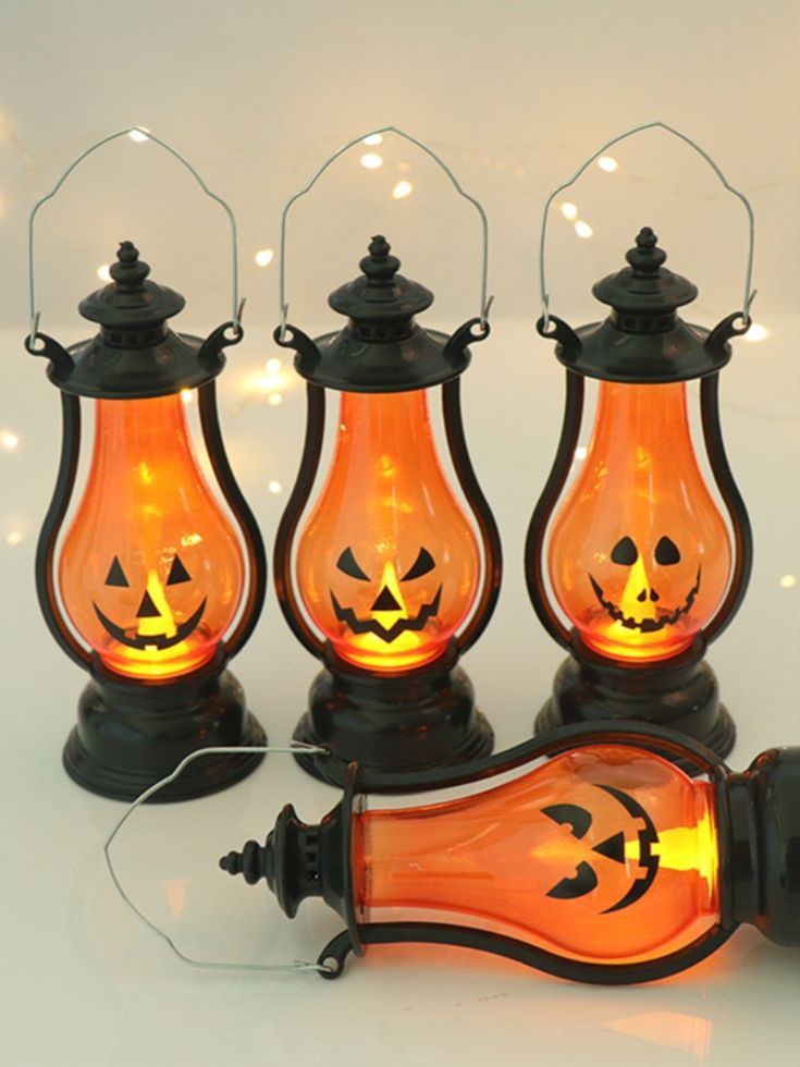 Set of glowing jack-o'-lantern lanterns for lining Halloween porch steps