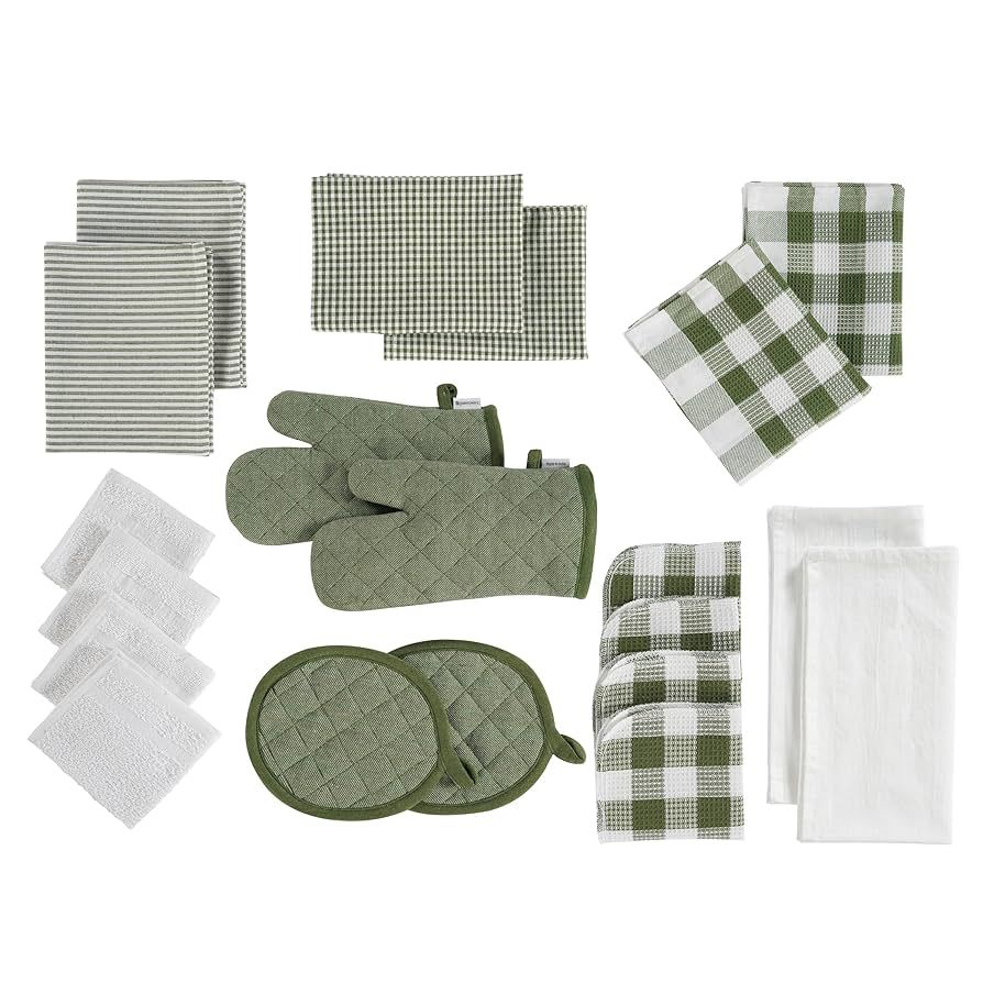 Sage green cups, bowls, and ivory-handled spoons organized in a kitchen drawer