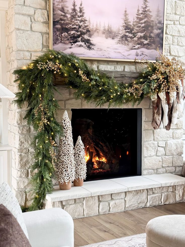 Christmas mantel with garland and decor styled heavier on one side