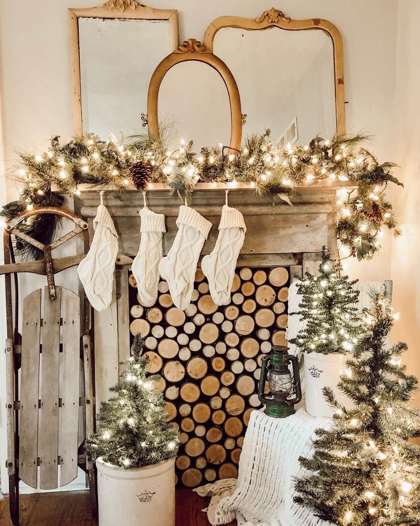 Colorful eclectic Christmas mantel with framed prints and a macrame tree