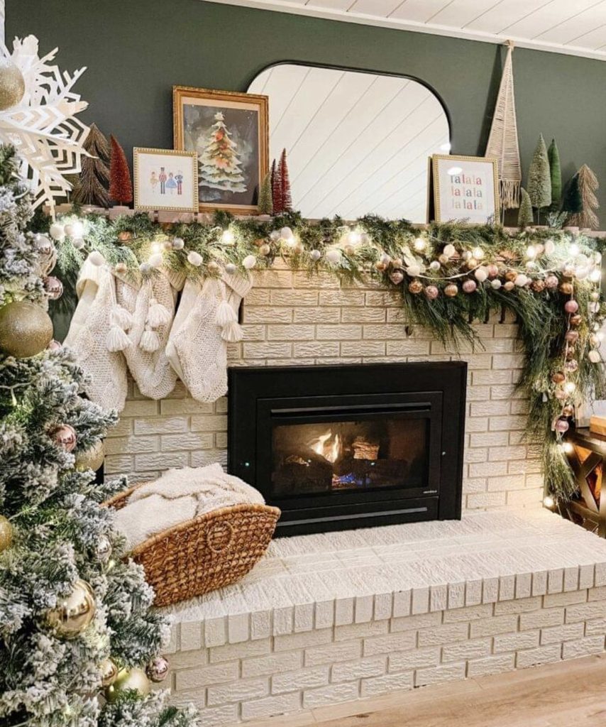 Christmas mantel styled with stacked vintage gold mirrors as the focal point