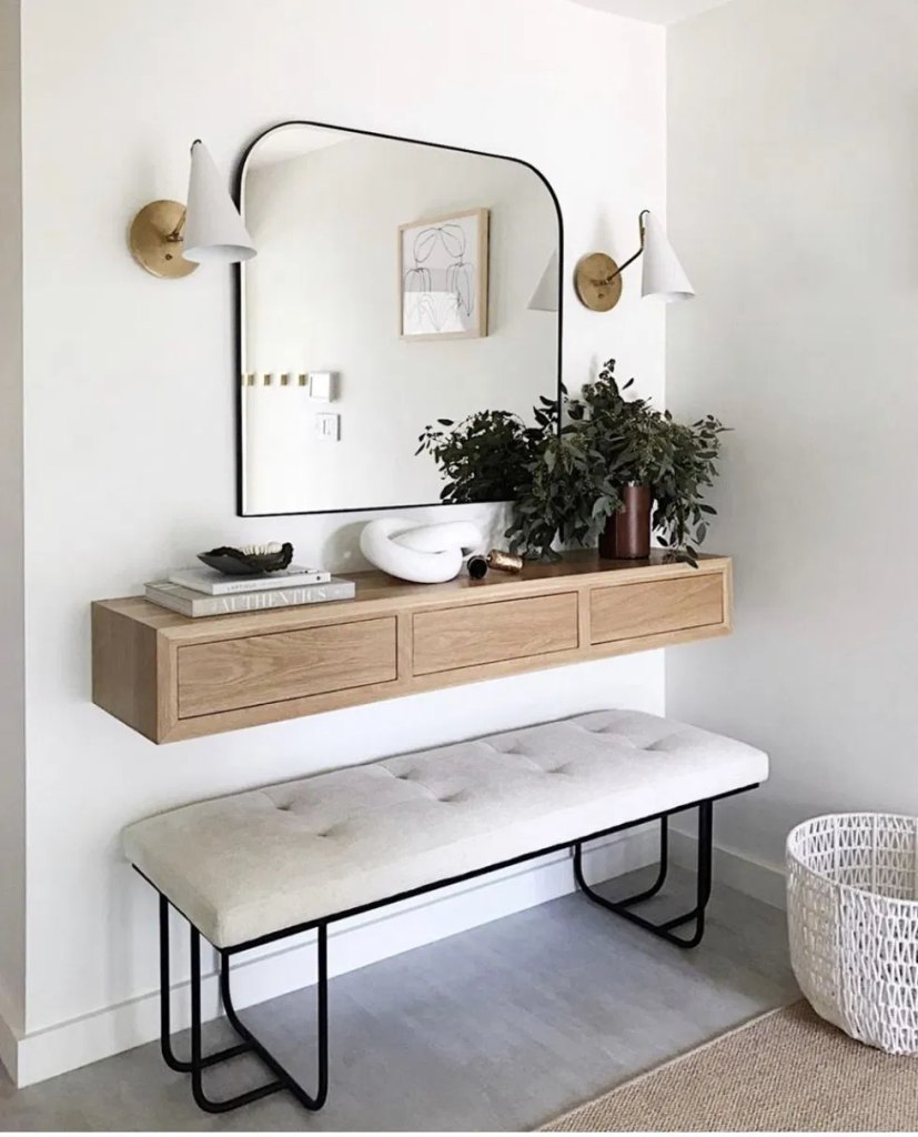 floating oak cabinet with three drawers mounted above a bench, a small entryway table idea