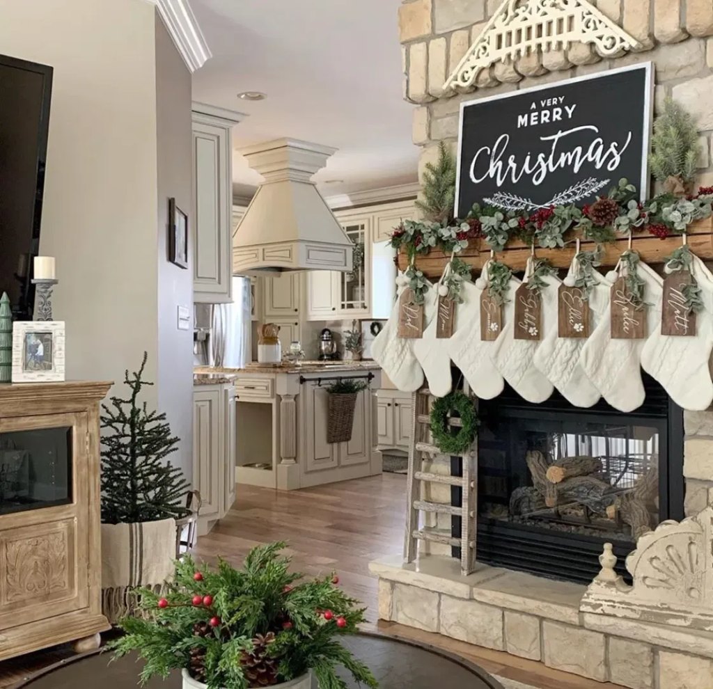 Rustic cabin Christmas living room with a stone fireplace, white knit stockings with wood